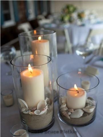 Beach-wedding-centerpiece-with-sand-and-candles
